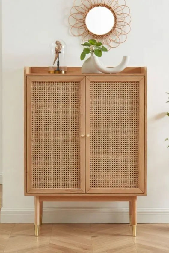 Wooden cabinet with wicker doors in a room setting