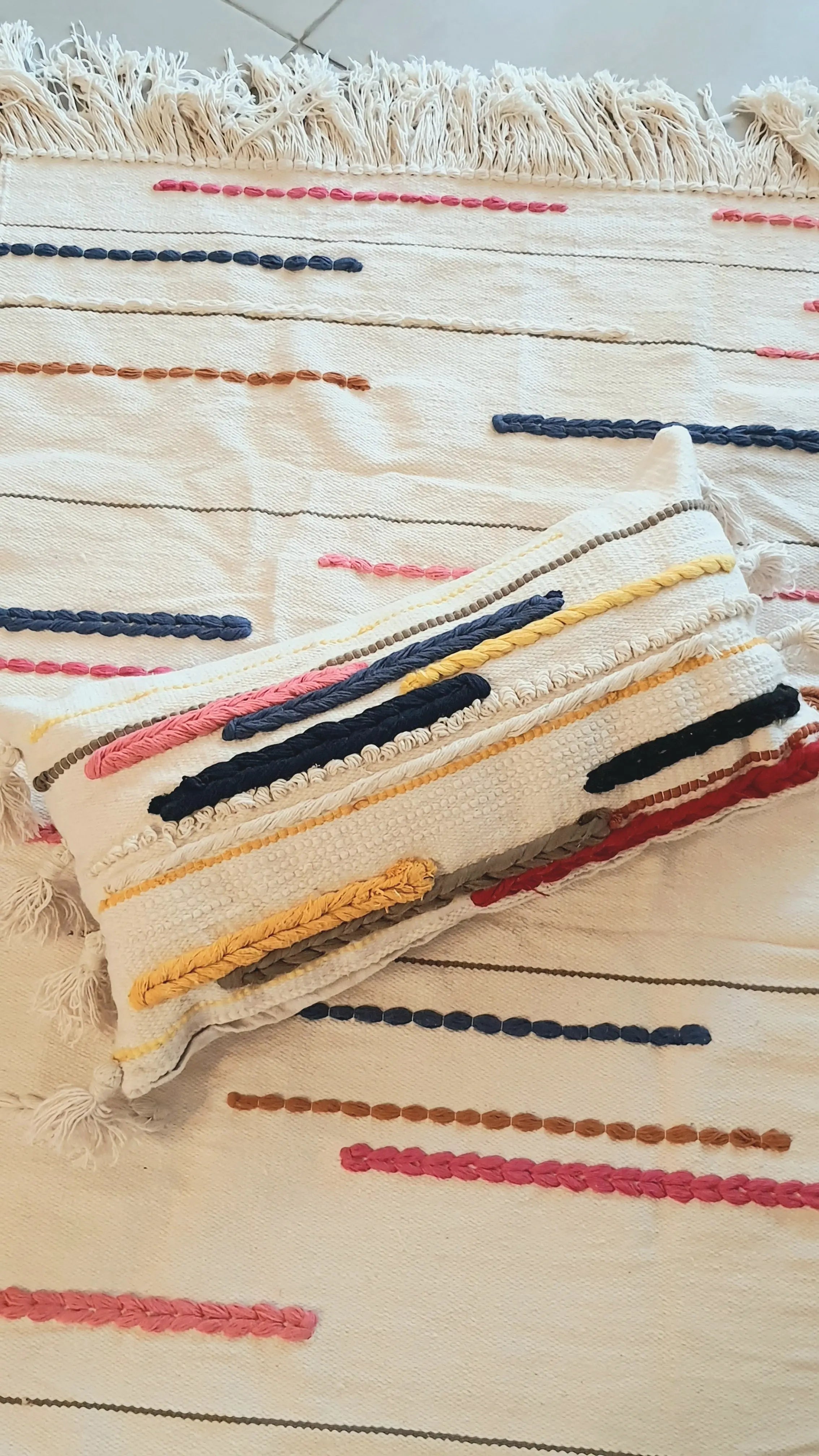Textile with colorful stripes on a wooden surface