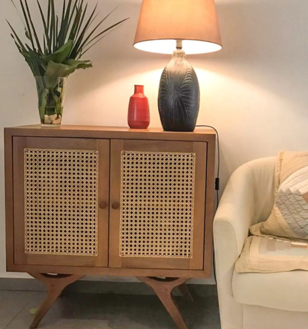 Wooden cabinet with wicker doors in a living room setting