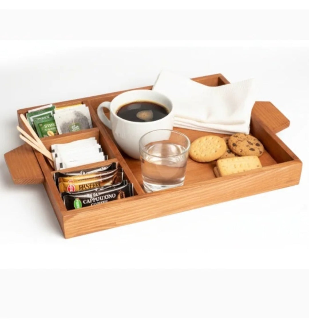 Wooden tray with coffee, cookies, and other items on a white background