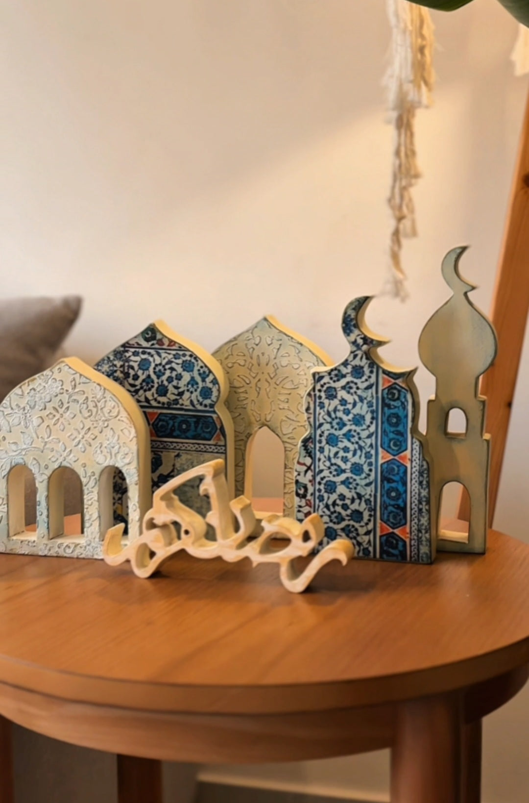 Decorative arches on a wooden table with a neutral background